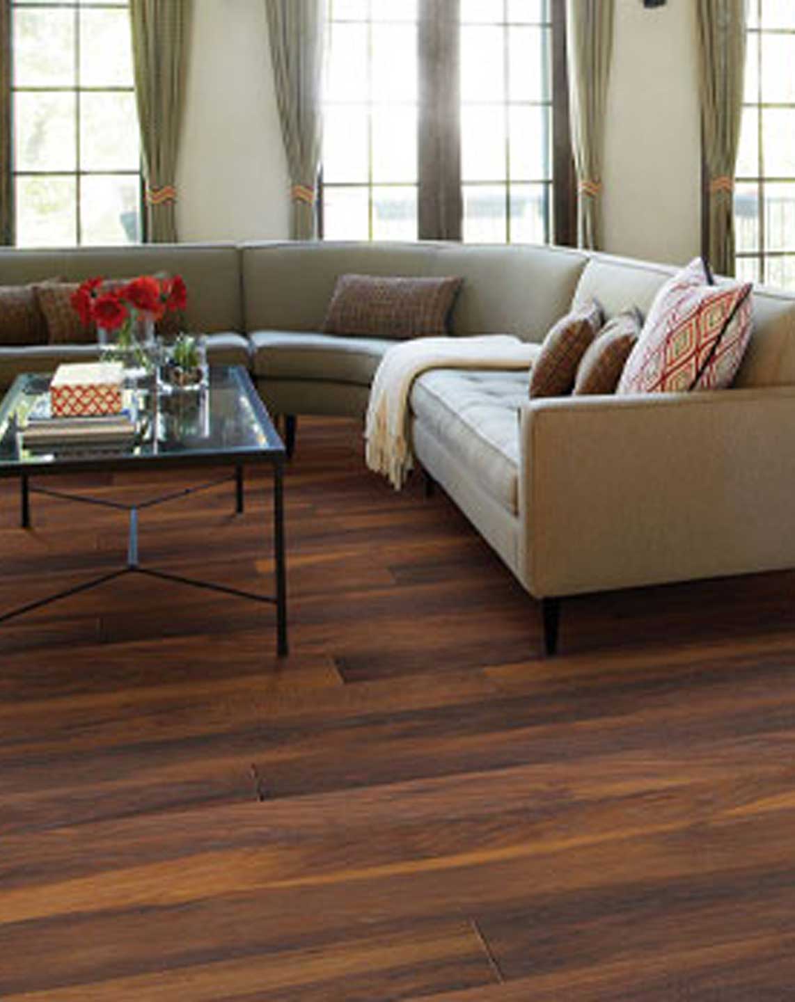 Hardwood flooring with tan couch living room